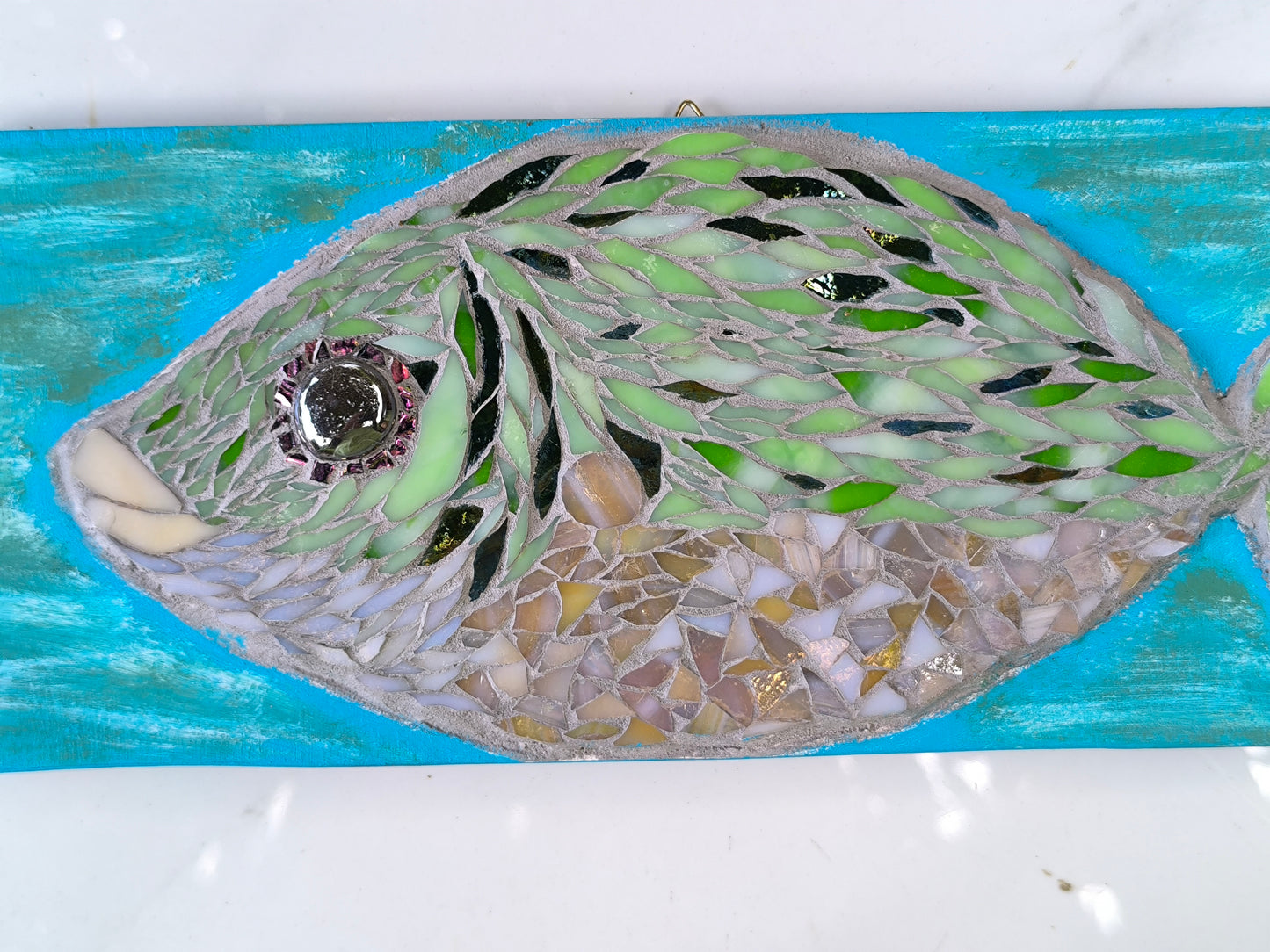 GREEN FISH IN TURQUOIZE WATERS