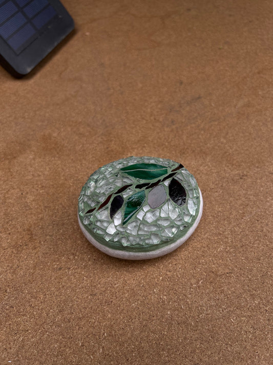 Olive branch on stone