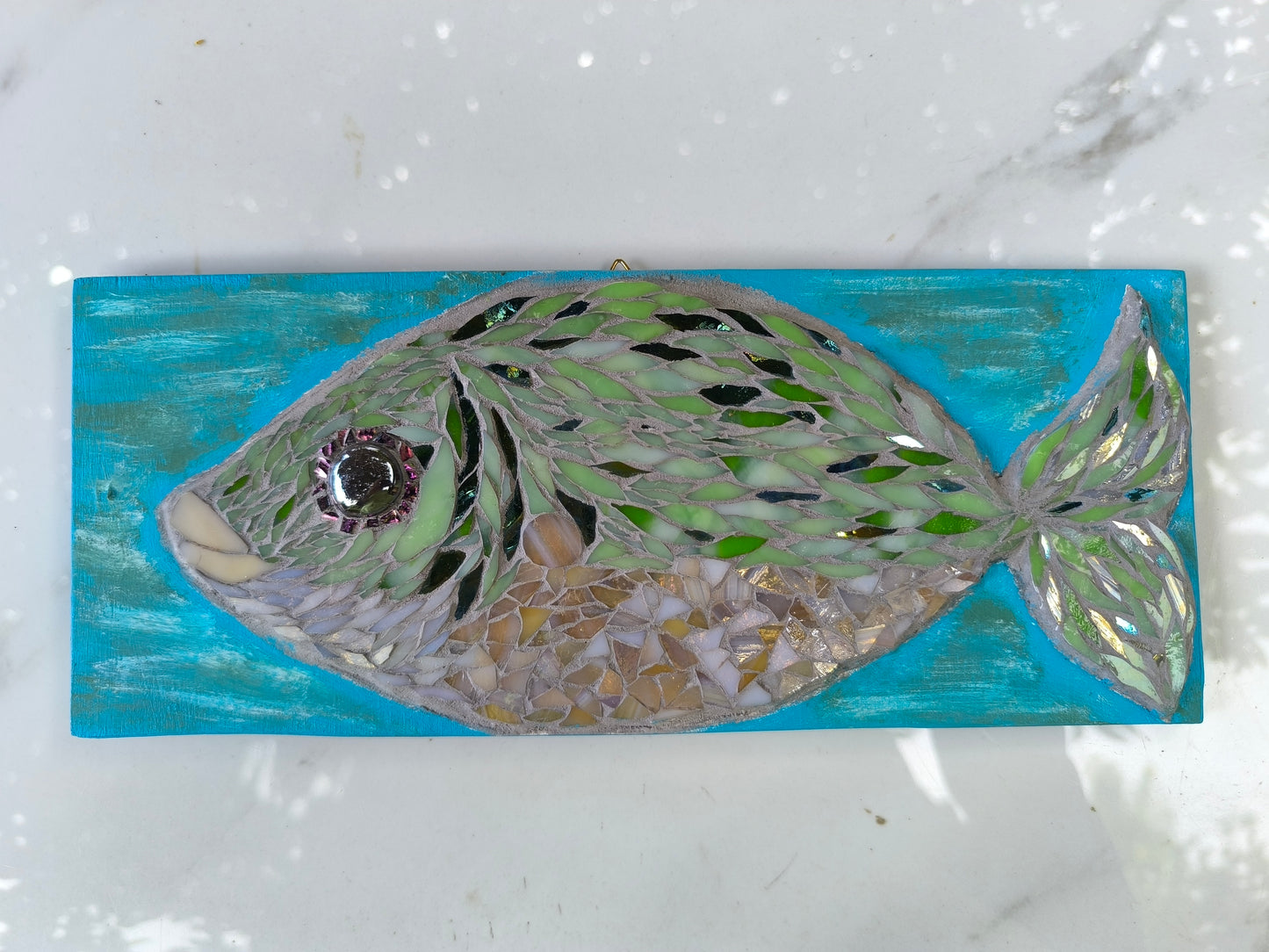 GREEN FISH IN TURQUOIZE WATERS