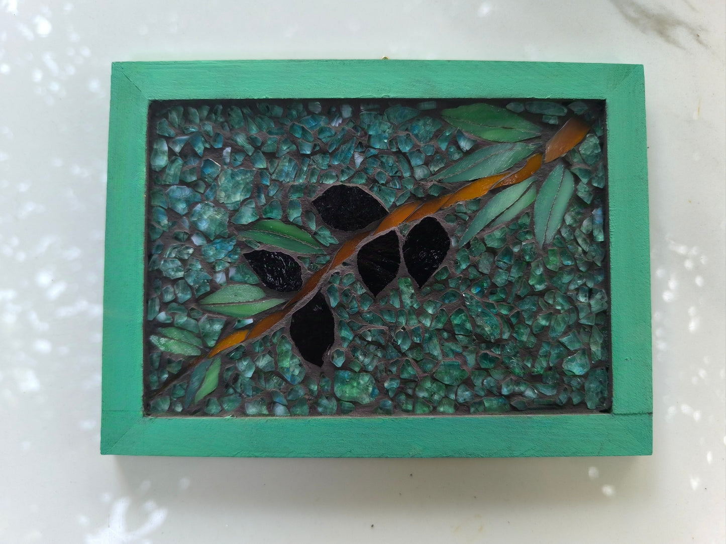 Mosaic olive branch in a frame